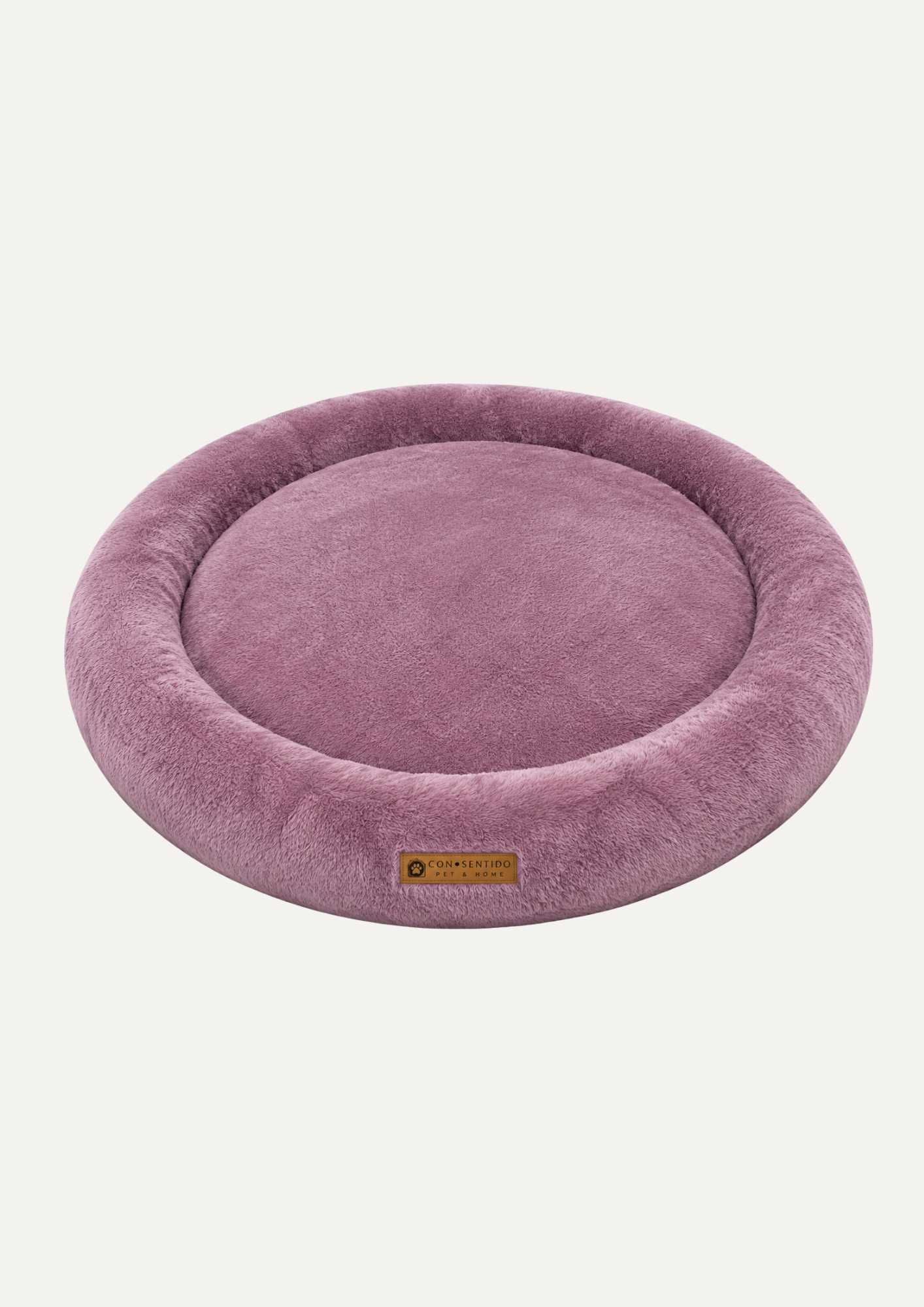 Cama Dona Roble para perros y gatos con centro ortopédico de espuma, bordes acolchados y acabado en tela suave color rosado, ideal para un descanso reparador.